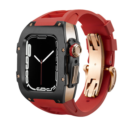 Ken Sailor T Series Apple Watch Ultra case with matte black bezel, rose gold crown hardware, and red silicone band featuring deployment clasp installed on Apple Watch Ultra 49mm for premium luxury smartwatch conversion.
