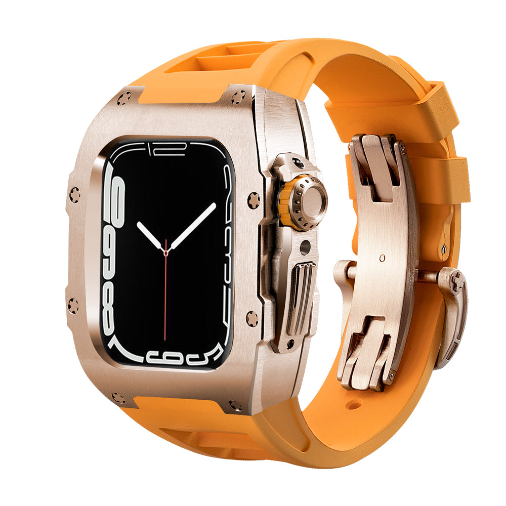 Ken Sailor T Series conversion case for Apple Watch Ultra with brushed rose gold metal housing, orange silicone performance band, and stainless deployment clasp for a luxury sport aesthetic.
