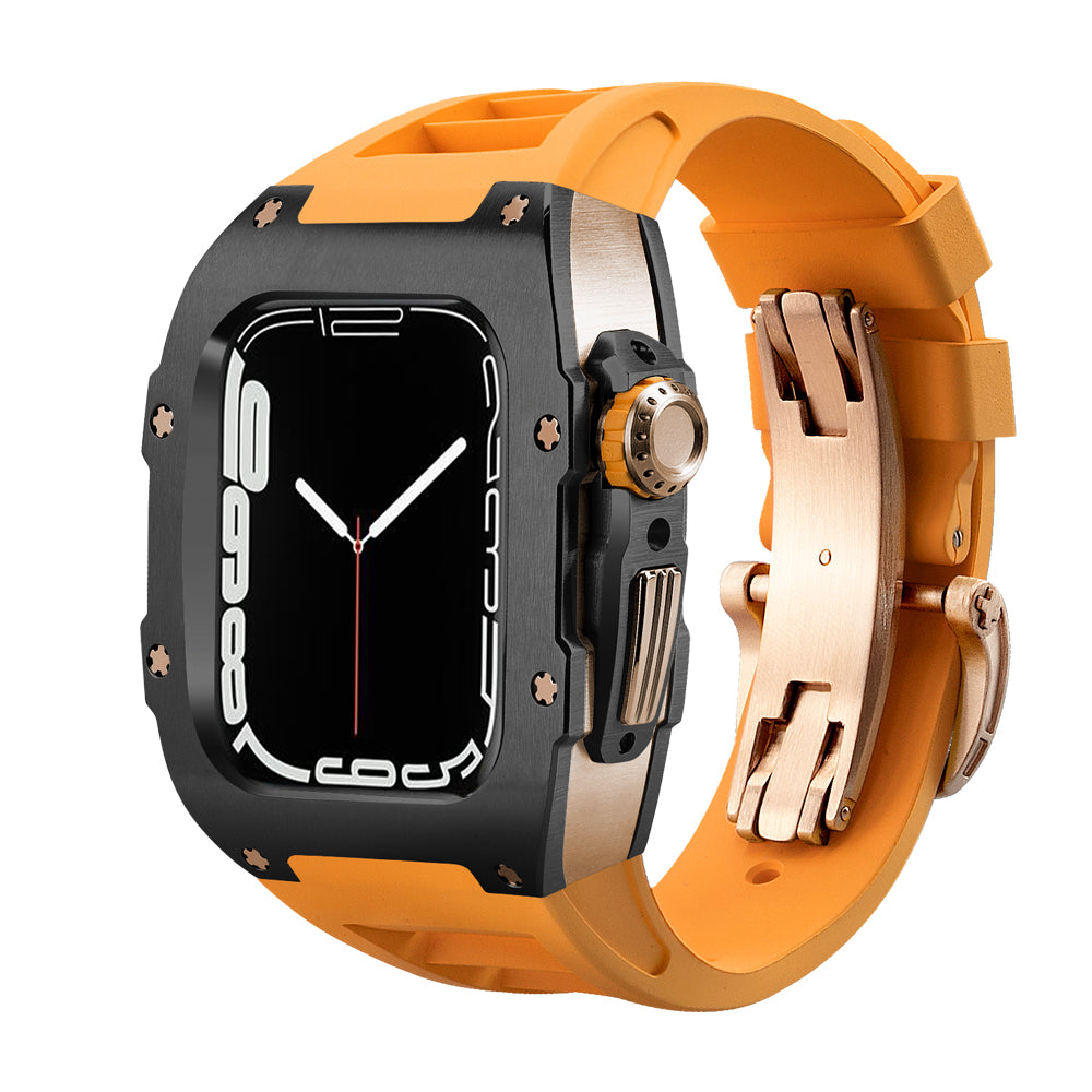 Ken Sailor T Series conversion kit for Apple Watch Ultra featuring a matte black bezel, rose gold mid-case components, and a bright orange silicone sports strap with deployment clasp for a premium racing-inspired aesthetic.
