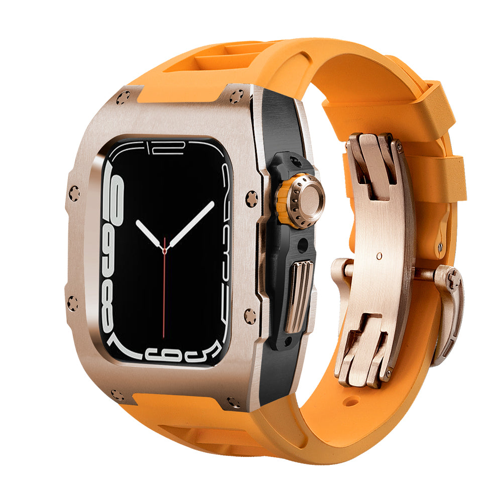 Ken Sailor T Series luxury conversion for Apple Watch Ultra featuring a brushed rose gold bezel, black mid-case housing, and orange silicone performance strap with deployment clasp for a sport-luxury look.

