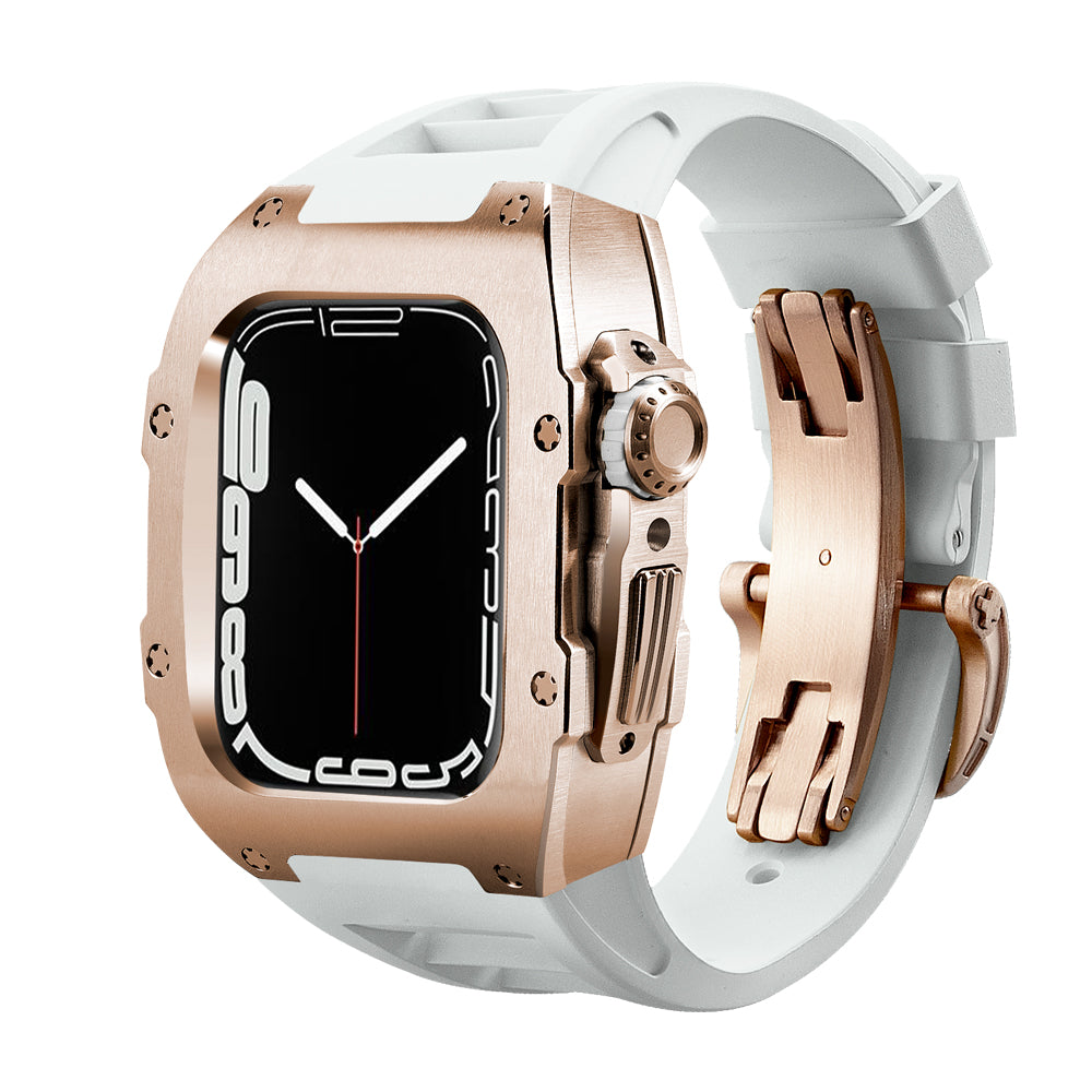 Ken Sailor T Series rose metal protective case for Apple Watch Ultra paired with white silicone performance band and matching deployment clasp, designed to convert the smartwatch into a luxury-style wrist timepiece.
