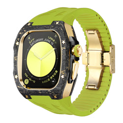 forged carbon apple watch case with gold hardware and green silicone strap, front angled product photo of high end luxury apple watch ultra conversion kit with deployant clasp and carbon marbling accents for ecommerce listing